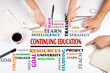 © STOATPHOTO - Continuing Education word cloud. The meeting at the white office table.