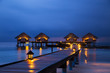 Water bungalows houses at sunset, tropical landscape. Maldives islands