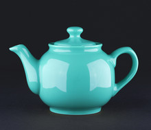 Blue Ceramic Teapot Isolated On Black Background