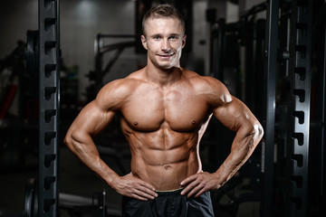  Handsome fitness model train in the gym gain muscle