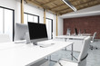 © ImageFlow - Close up of computer in a brick wall office