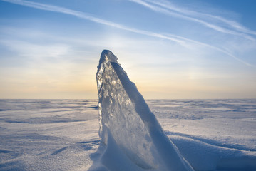 Wall Mural - blocks of ice gleaming in the sun, snow, frost, frozen water surface.