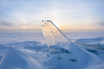 Wall Mural - blocks of ice gleaming in the sun, snow, frost, frozen water surface.