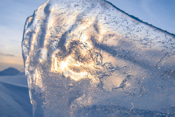 Wall Mural - blocks of ice gleaming in the sun, snow, frost, frozen water surface.