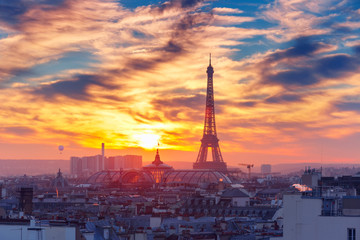 Aerial view of Eiffel tower and the rooftops of Paris during a gorgeous sunset, France