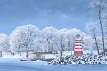 Navigation Lighthouse On The Winter Coast