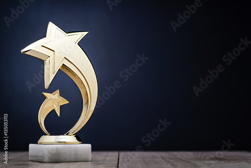Fotografía Elegant winners trophy with shooting stars