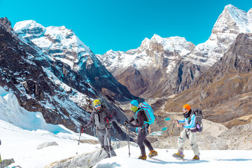 Group of Mountain Hikers traversing Glacier