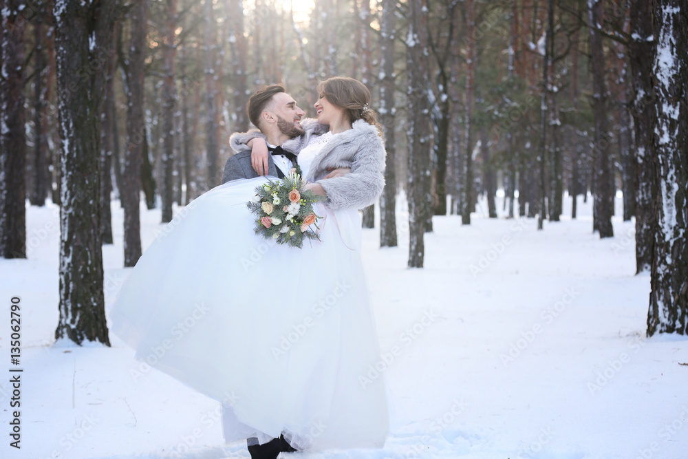 Happy wedding couple outdoors on winter day Stock Photo | Adobe Stock