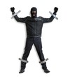 © vchalup - Thief or burglar masked with balaclava is caught and is taped to the wall with adhesive tape. Isolated on white background.