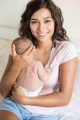 Wall Mural - mother holding newborn baby