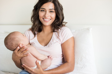 Wall Mural - Mother holding newborn baby