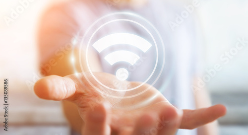 Fotografía Businessman using free wifi hotspot interface 3D rendering