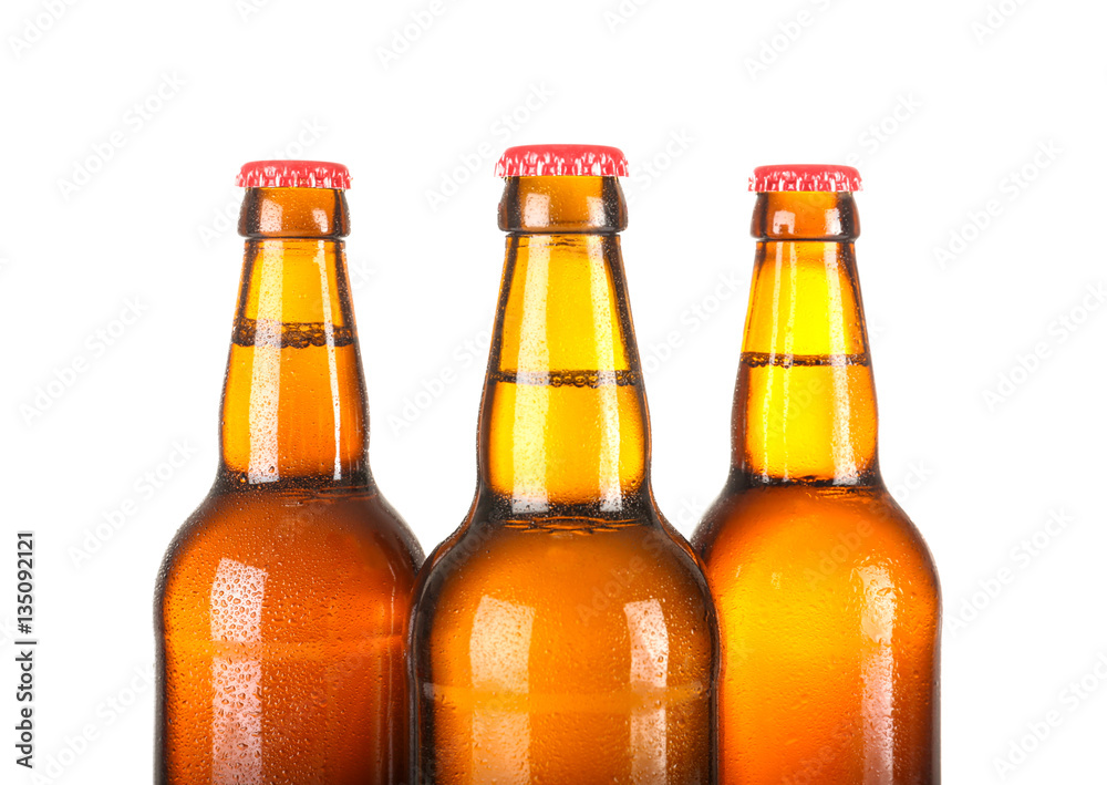 Beer bottles in a row isolated on white