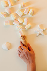 ice cream cone with bunch of marshmallows on white background