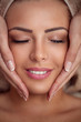 woman receiving professional face massage