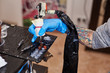 © belyjmishka - Master tattoo artist prepares tools for tattooing