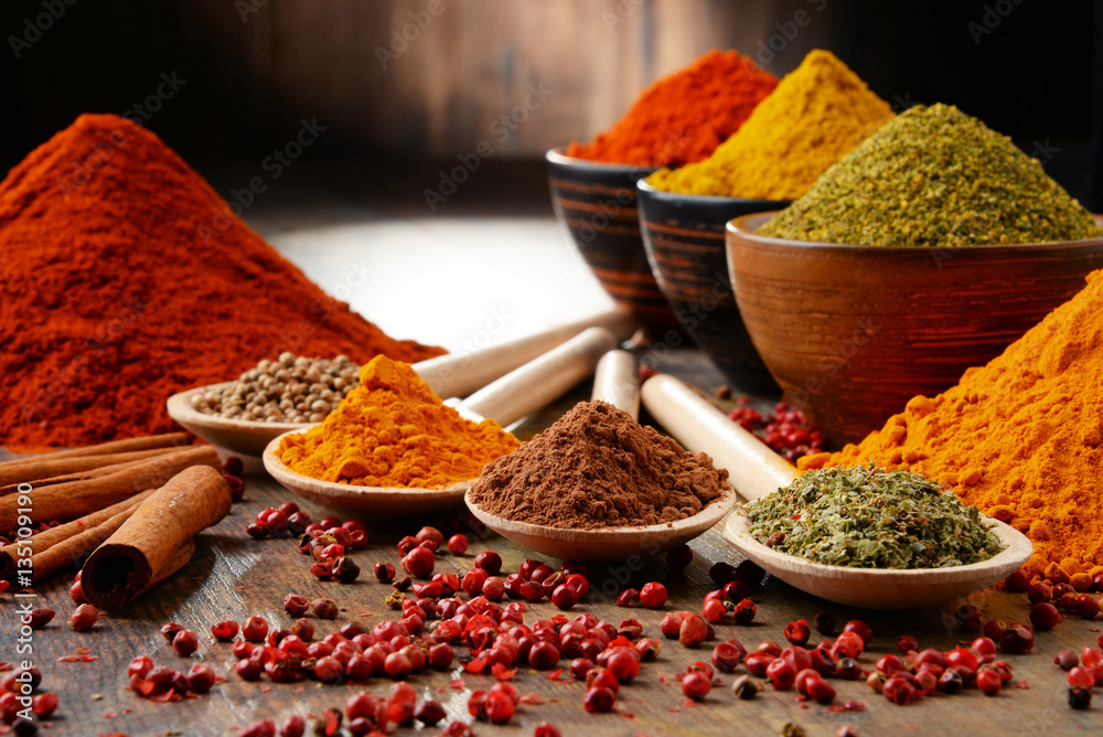 Variety of spices on kitchen table - obrazy, fototapety, plakaty 