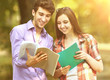 © yurolaitsalbert - group of happy students with books in the Park on a Sunny day.