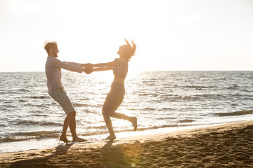 happiness and romantic scene of love couples partners on the beach