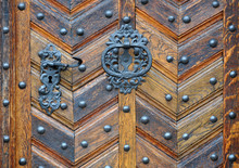 Vintage Wooden Door Texture With Round Metal Elements.