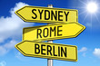 © PX Media - Sydney, Rome, Berlin - signpost with yellow arrows.