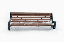 Empty Brown Wooden Bench Outdoor In A Park In Winter Front View Closeup