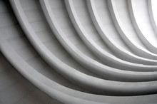 Architectural Background. Modern White Concrete Arched Composition In Perspective. Semicircular Shapes. The Light In The End.