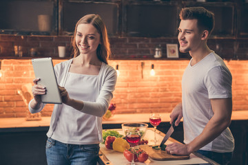 Wall Mural - Beautiful couple cooking