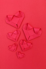 Poster - six folding red paper hearts on red for valentine pattern and ba