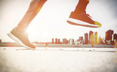 Wall Mural - Low section of sport man running in New york