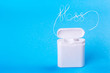 Dental floss word written in letters of floss on a blue background