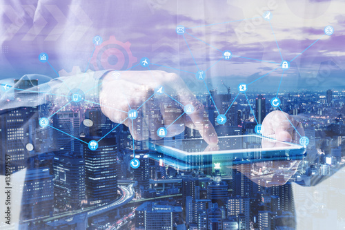 Fotografie, Obraz Double exposure of businessman hand touching digital tablet over