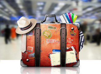 Wall Mural - retro suitcase of a traveler with travel stickers