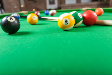 Snooker ball and stick on billiard table