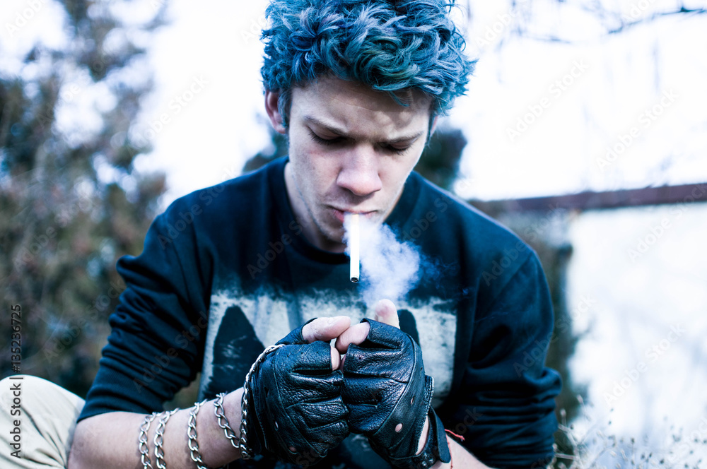 cigarette cool Young cool rocker smoking cigarette Stock Photo