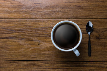 White cup of coffee on vintage wood. Top view ,  cup on wooden t