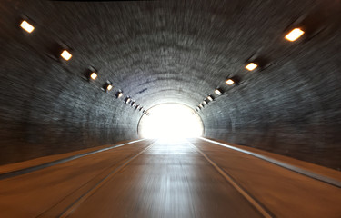 defocused photo on light at the end of tunnel