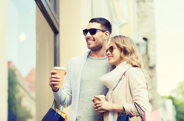 Sticker - happy couple with shopping bags and coffee in city