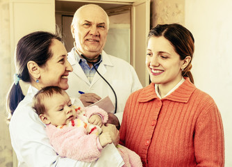 Wall Mural -   doctors talks to young mother of  baby