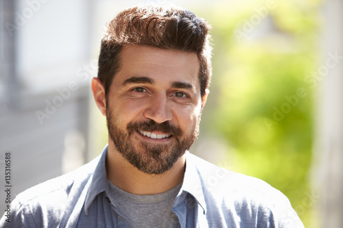 Outdoor Head And Shoulders Portrait Of Smiling Mature Man Poster