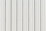 Light gray metal siding with shadows