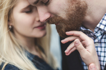 Love Story. Happy couple man and woman. High, white building.