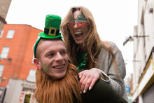 Smiling Young Couple Having Fun During St Patrick's Day In Dubli
