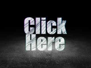 Web development concept: Click Here in grunge dark room