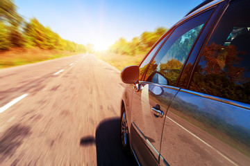 Poster - Blurred road and car, speed motion background