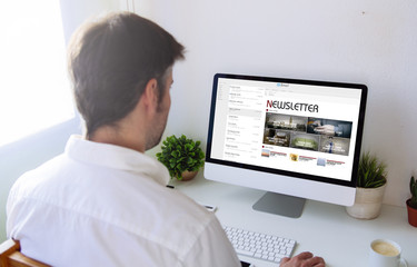 Poster - man reading newsletter on computer