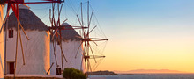 Old windmills on the sunset, Mykonos island, Greece
