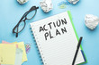 © ARAMYAN - action plan text on notebook with stationary