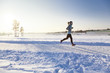 Jogging woman in winter with copy space